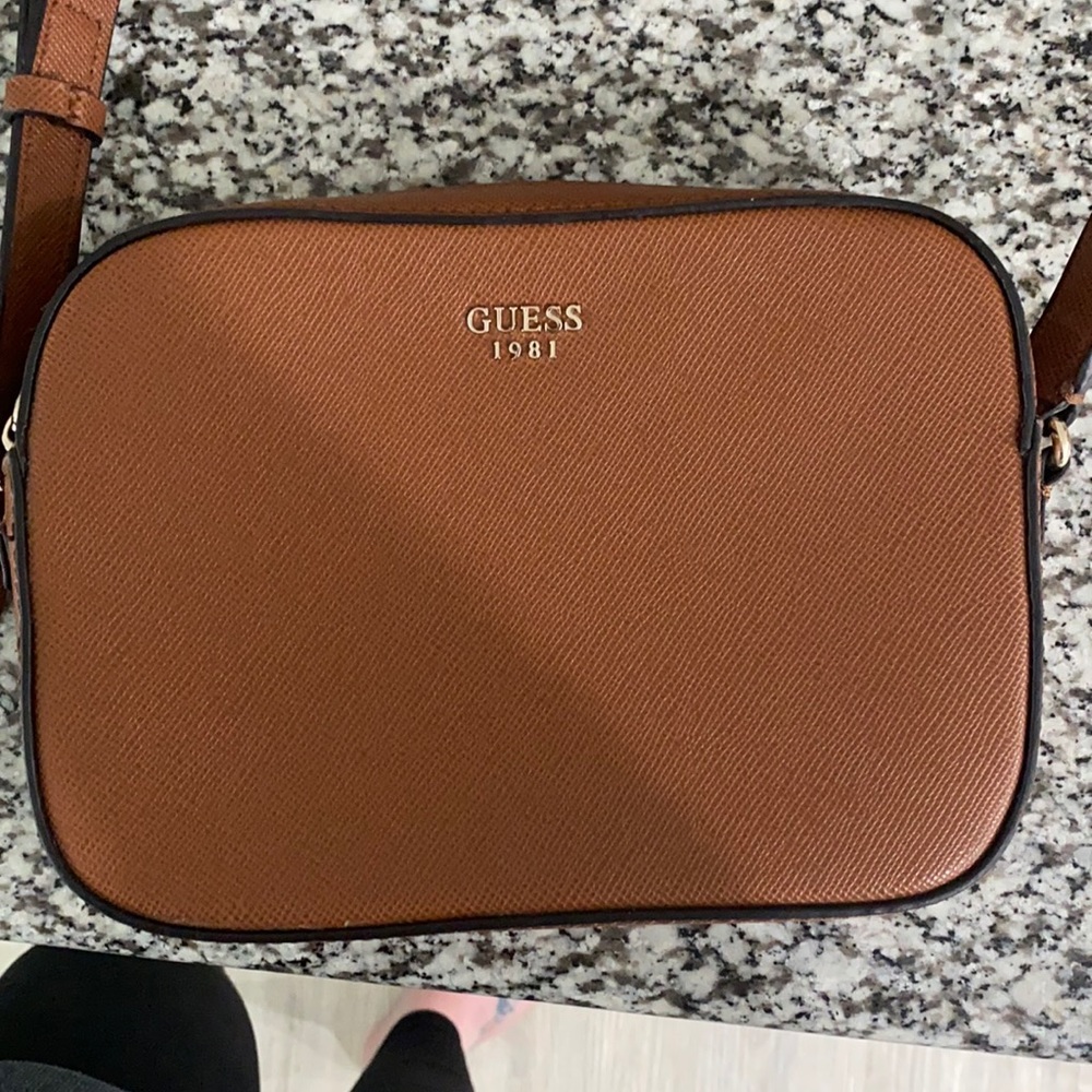 Brown cross body purse.